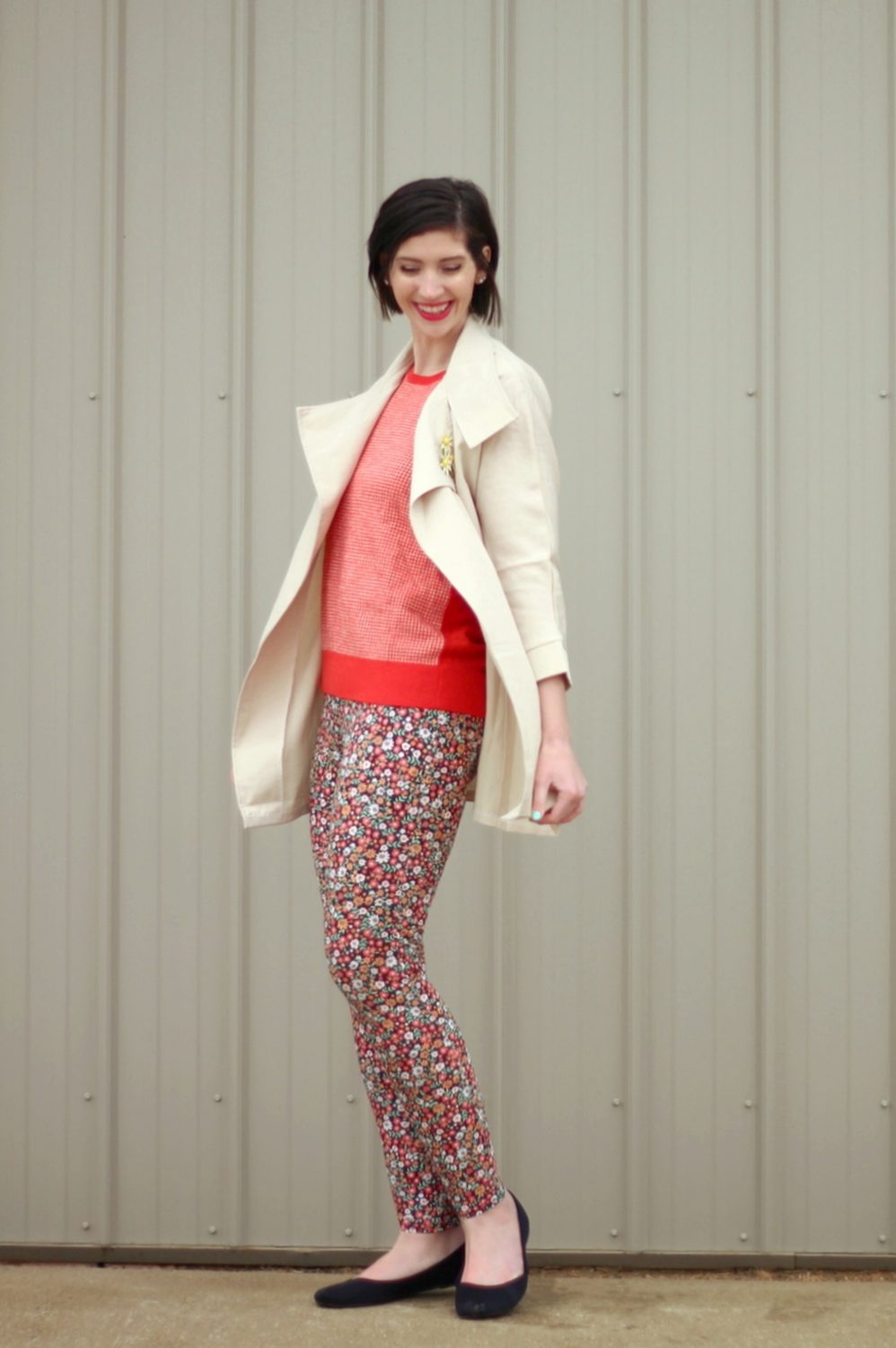 pattern mixing, orange sweater, floral pants, 1980s trench coat, vintage style, outfit