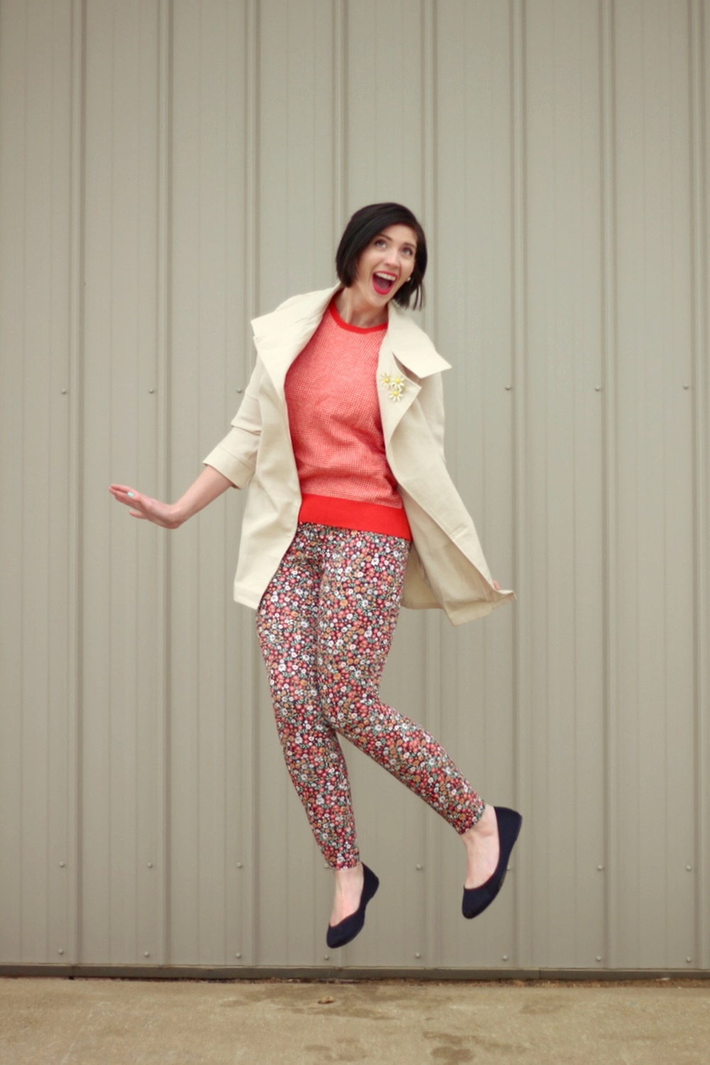 pattern mixing, orange sweater, floral pants, 1980s trench coat, vintage style, outfit