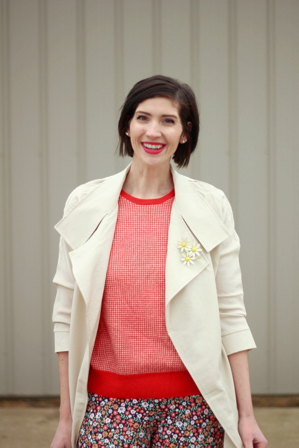 pattern mixing, orange sweater, floral pants, 1980s trench coat, vintage style, outfit