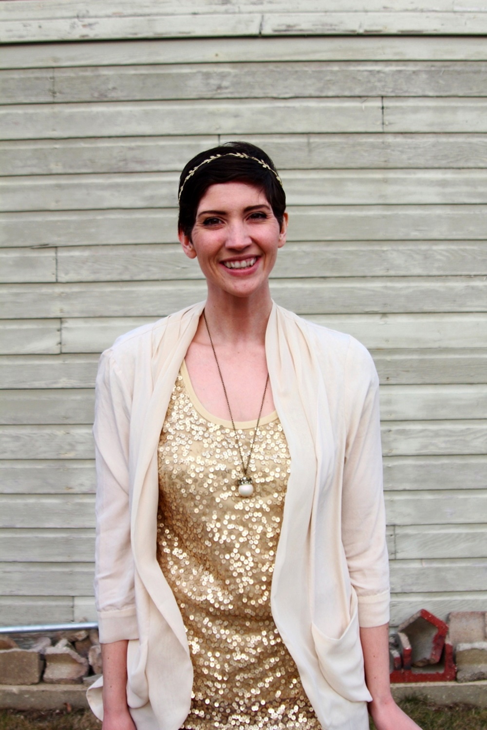 Gold sequin t-shirt, cream color cover-up, crown necklace, gold leaf headband, thrifted maroon jeggings, ThredUp nude flats