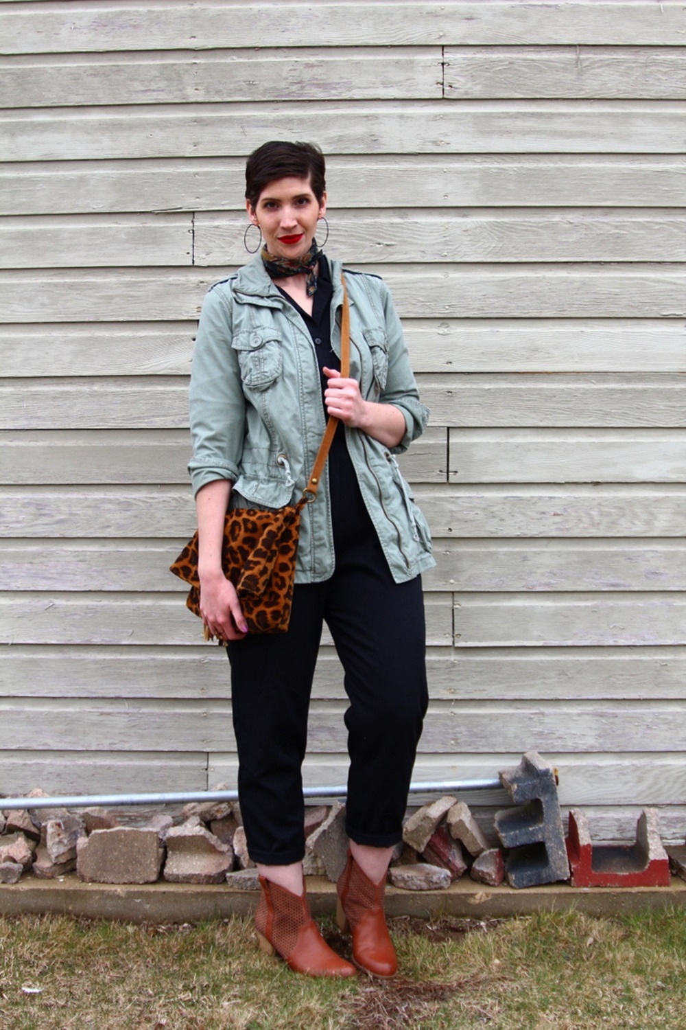 vintage black jumpsuit fashion jungle red lipstick leopard print purse neckerchief scarf olive green jacket thrifted brown booties