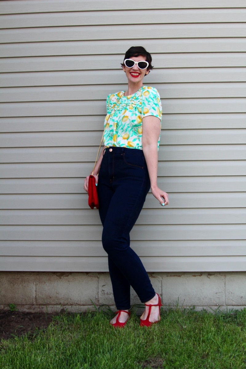 outfit Lemon print blouse, high waisted jeans, red flats, MAC Ruby Woo lipstick, curly pixie haircut, red purse