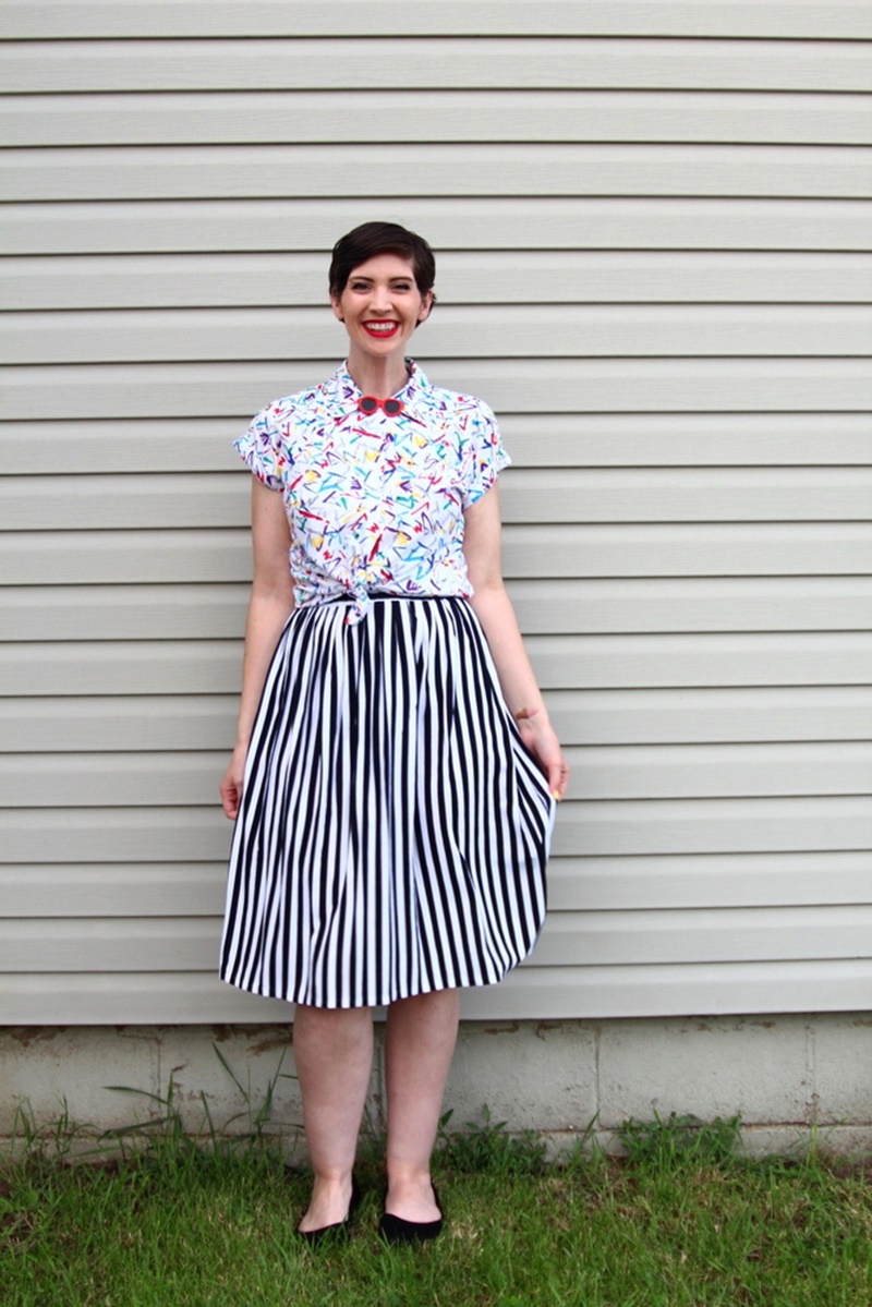 Memorial day outfit, thrifted black and white striped skirt, vintage abstract printed button up, Colourpop lippie stix Bossy red, black Walmart flats, 1980s sunglasses lapel pin