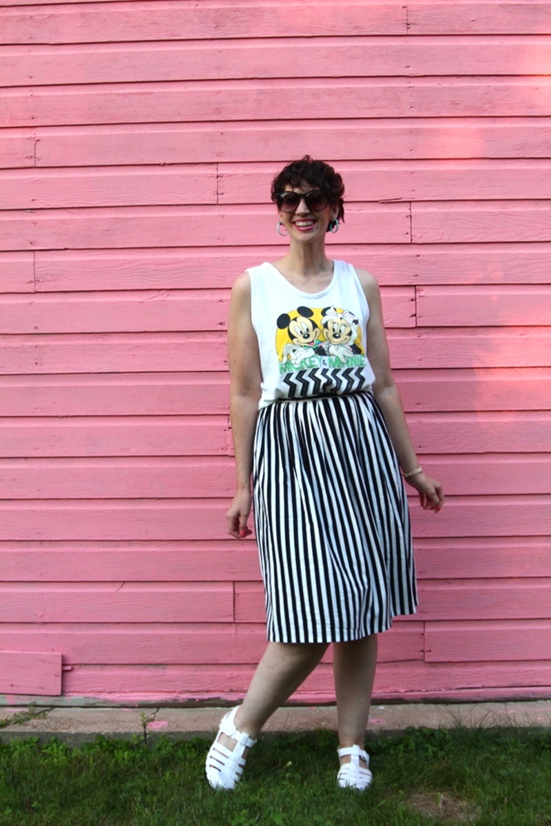 A Minnie (and Mickey) 1980s Outfit Post | #LiveFromThe80s | theoutfitrepeater.com 1980s outfit post striped skirt, mickey and minnie tank top, vintage sunglasses, jelly sandals, retro earrings