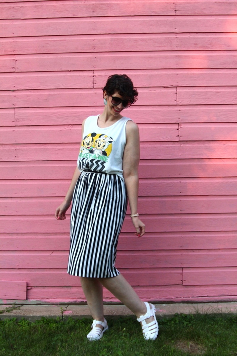 1980s outfit post striped skirt, mickey and minnie tank top, vintage sunglasses, jelly sandals, retro earrings