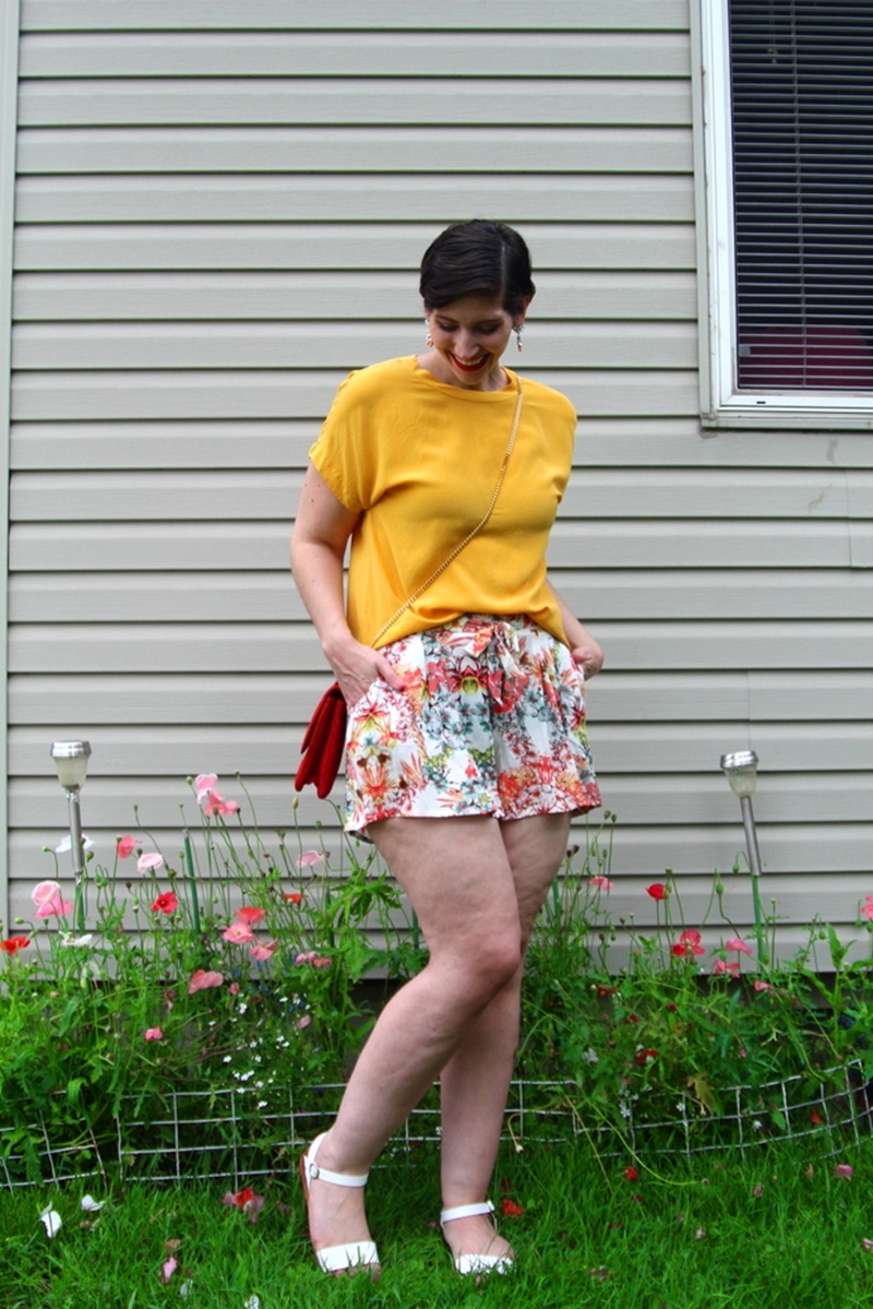 Going Outside My Comfort Zone in Floral Shorts + How You Can Do It Too | theoutfitrepeater.com outfit detail floral shorts summer, yellow blouse, red purse, colourpop bossy lippie stix, pixie hair cut, lulus white sandals