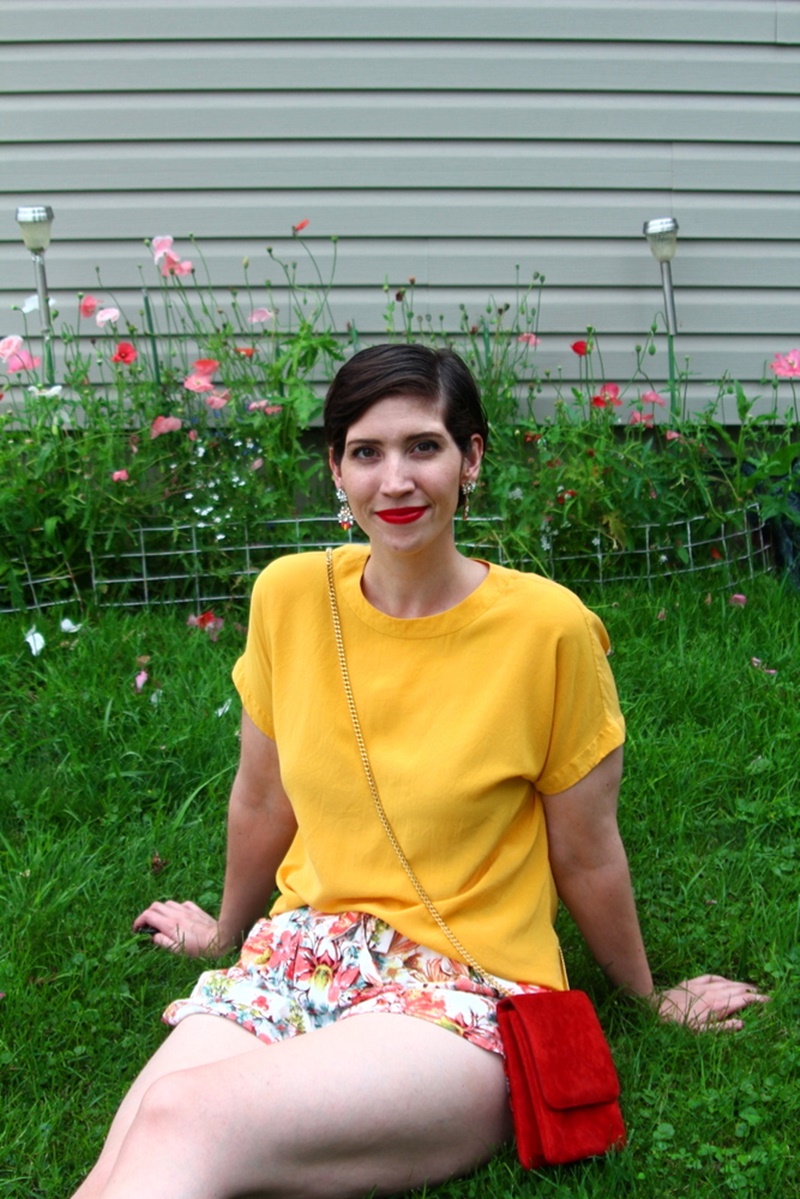 outfit detail floral shorts summer, yellow blouse, red purse, colourpop bossy lippie stix, pixie hair cut, lulus white sandals