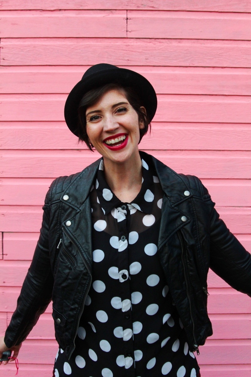 the outfit repeater hannah rupp, thrifted polka dot button up, thredUP red leopard print pants, H&M leather jacket, seven dials shoes black cutout booties, asos pork pie hat, colourpop lippie stix lbb