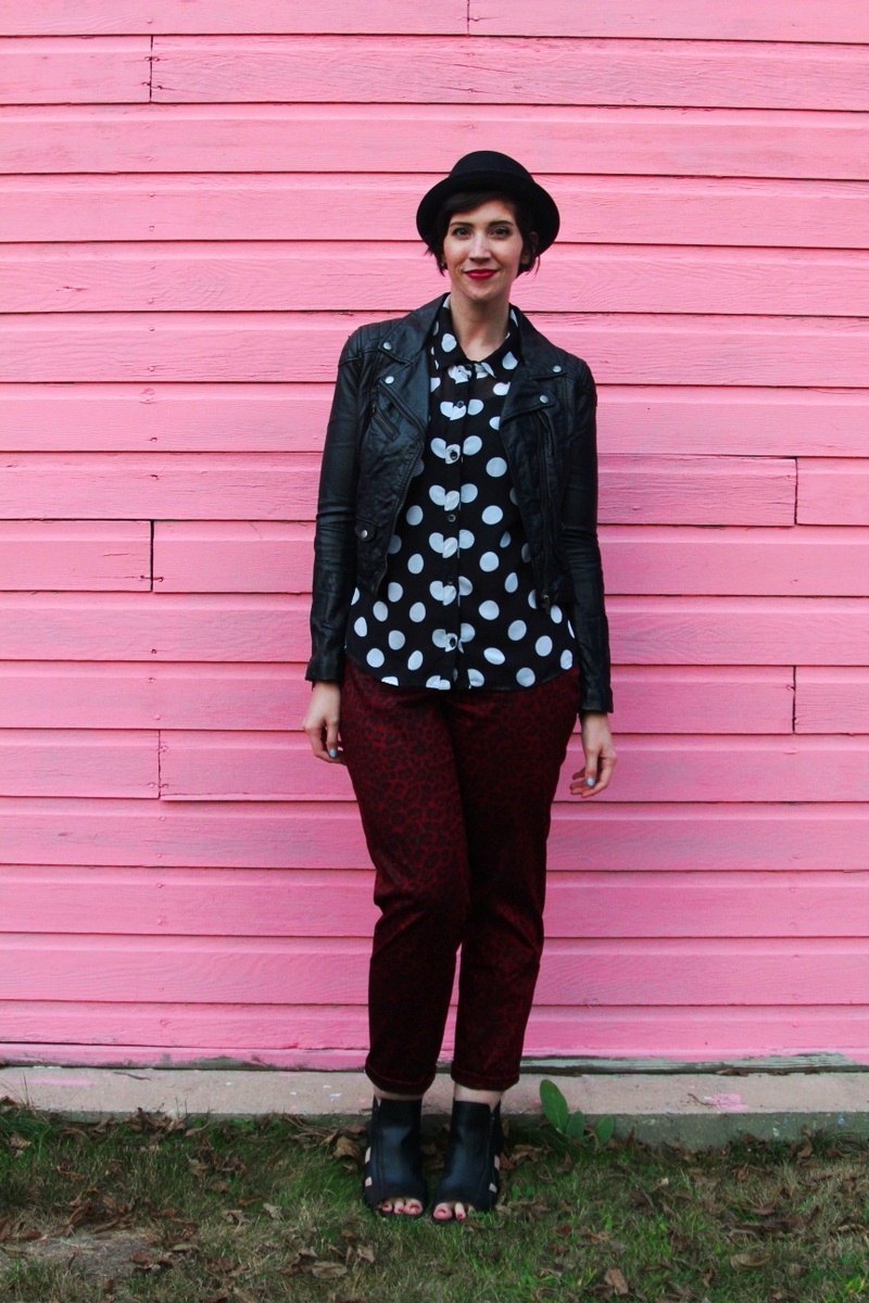 the outfit repeater hannah rupp, thrifted polka dot button up, thredUP red leopard print pants, H&M leather jacket, seven dials shoes black cutout booties, asos pork pie hat, colourpop lippie stix lbb