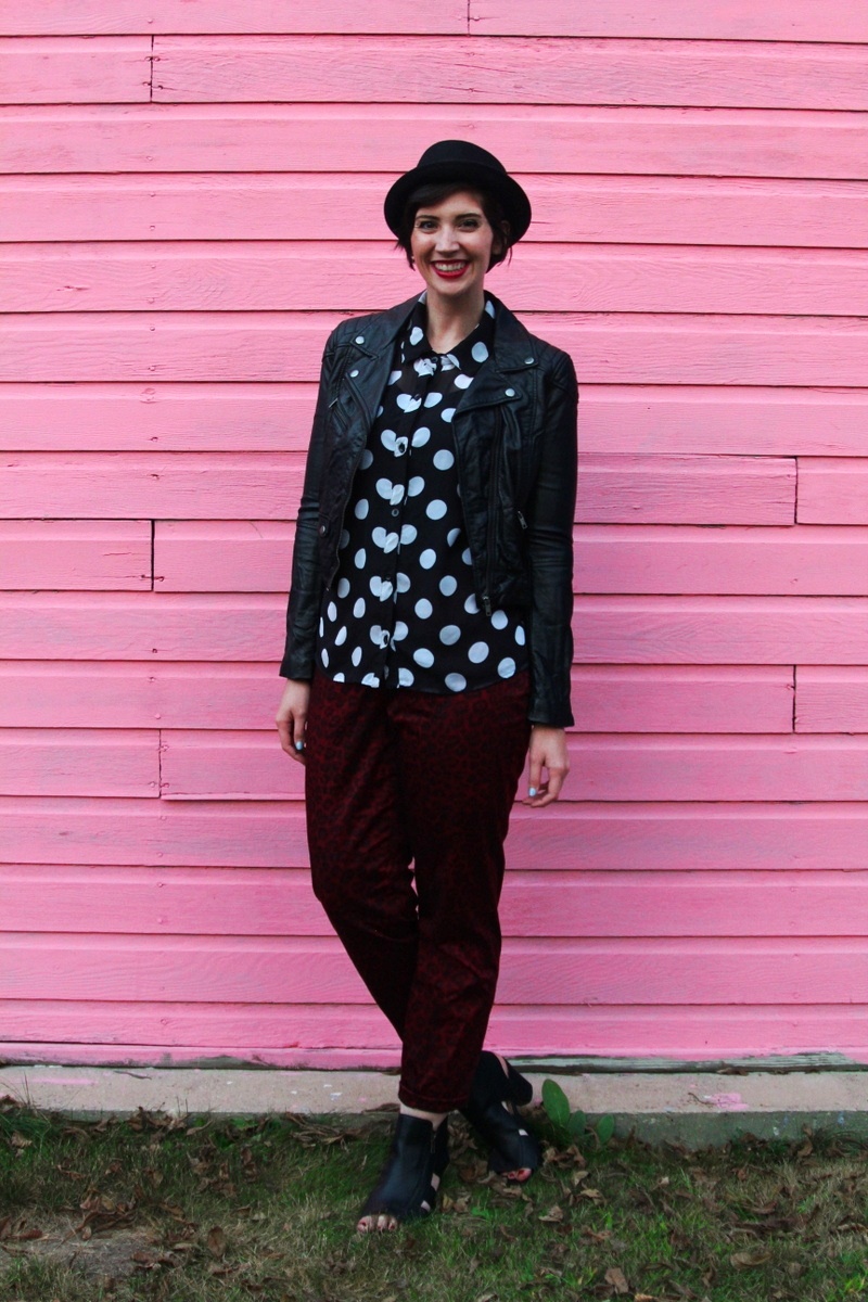 the outfit repeater hannah rupp, thrifted polka dot button up, thredUP red leopard print pants, H&M leather jacket, seven dials shoes black cutout booties, asos pork pie hat, colourpop lippie stix lbb