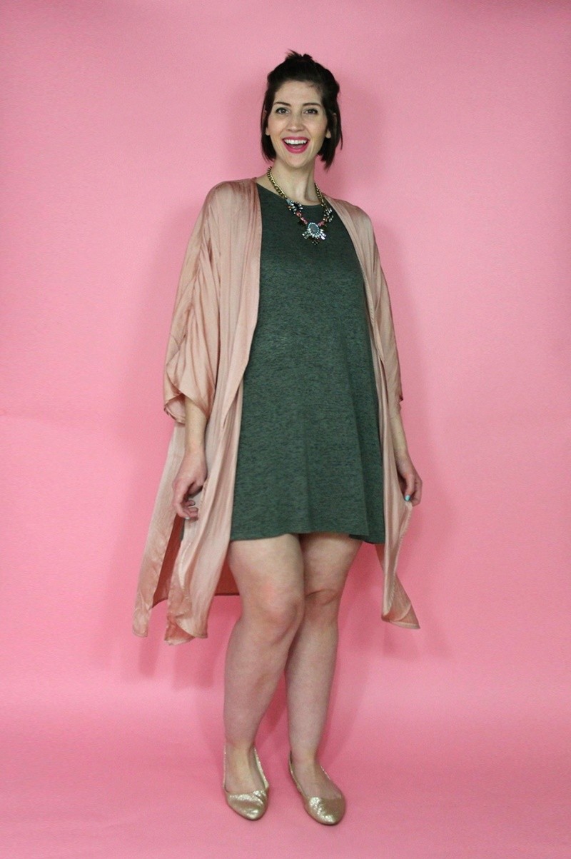 valentine's day outfit hannah rupp wears a green dress, pink kimono, and statement necklace