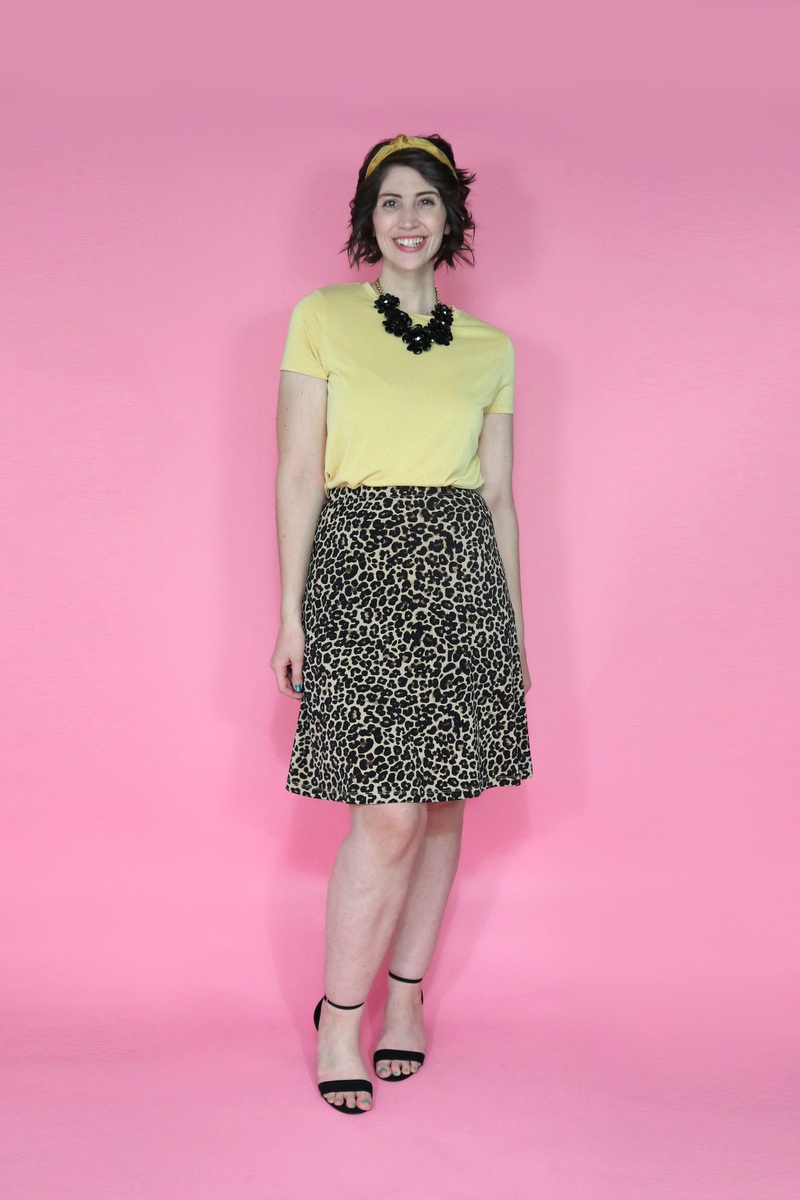 best thrifted clothes yellow tee leopard print skirt black high heels outfit