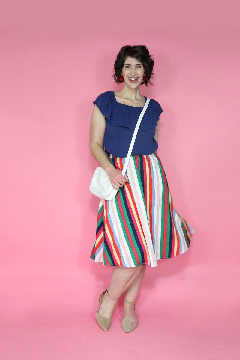 best thrifted clothes rainbow skirt thredup navy blue off the shoulder ruffled blouse white purse outfit