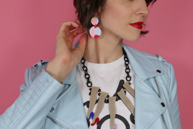 3 Questions That Will Change The Way You Look At Your Closet | www.theoutfitrepeater.com Hannah is wearing bright red lipstick, colorful polymer clay earrings, a statement necklace, and a light blue moto jacket