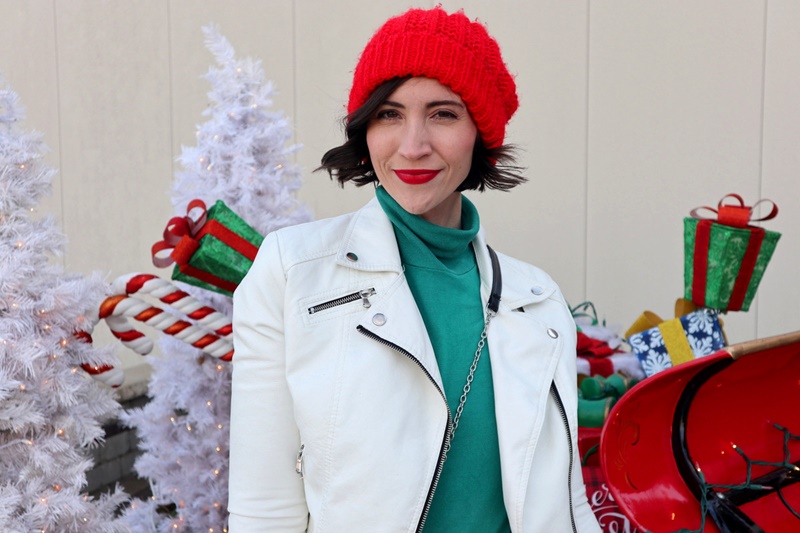 A Cute & Affordable Christmas Outfit That Sleighs | www.theoutfitrepeater.com thrifted christmas outfit green turtleneck thredup white moto jacket red beanie hat
