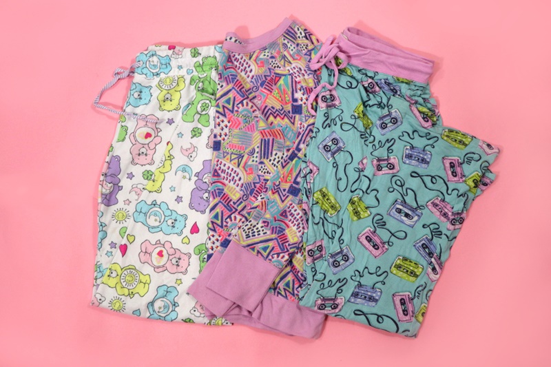 My Top 6 Style Goals of 2022 | www.theoutfitrepeater.com a stack of colorful, 1980s inspired pajamas on a backdrop hannah rupp the outfit repeater