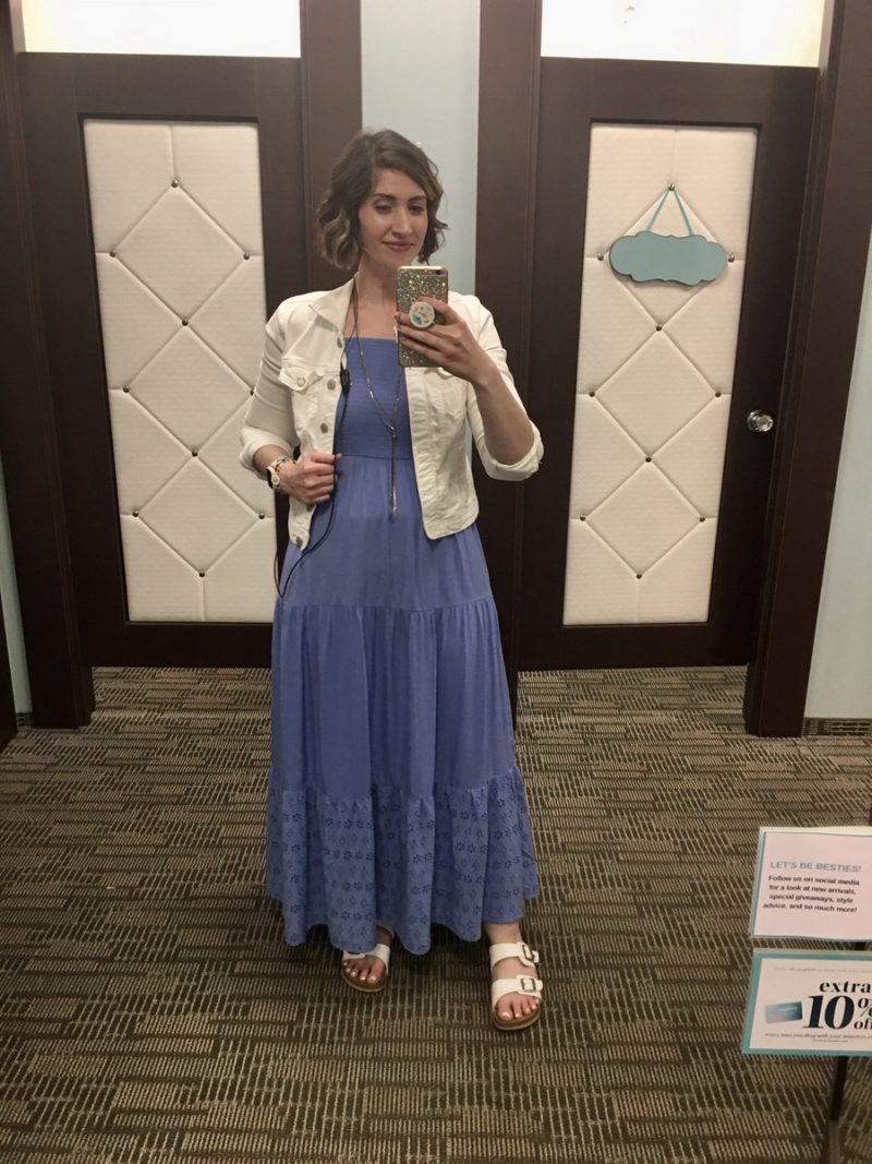 Outfit Photo Dump: What I Wore At Work (In A Clothing Store!) | www.theoutfitrepeater.com hannah is standing in front of a mirror. she's wearing a long blue maxi dress, white denim jacket, and white sandals
