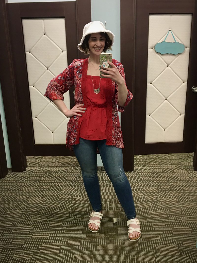 Outfit Photo Dump: What I Wore At Work (In A Clothing Store!) | www.theoutfitrepeater.com hannah is standing in front of a mirror. she's wearing a tank tank top, red paisley kimono, light wash jeggings, white sandals, and a white bucket hat