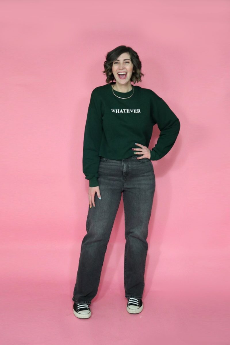 Jeans I Thrifted + 3 Ways I'm Styling Them | www.theoutfitrepeater.com hannah rupp is similar wearing a green cropped sweatshirt and high waisted thrifted jeans