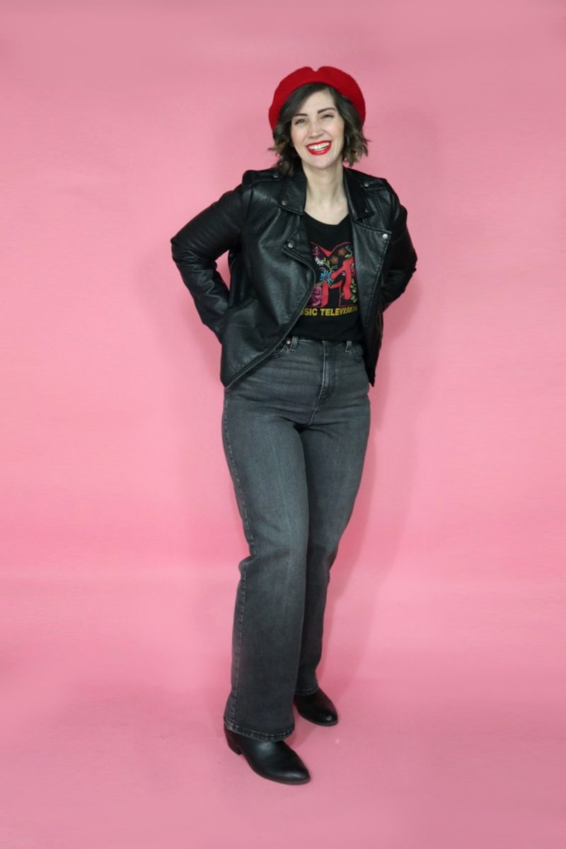 Jeans I Thrifted + 3 Ways I'm Styling Them | www.theoutfitrepeater.com hannah rupp is smiling wearing a red beret and red lipstick. she has on a black graphic tee, moto jacket, and thrifted high waisted Levi jeans.