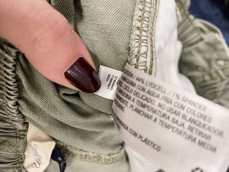 a clothing care tag on a thrifted garment