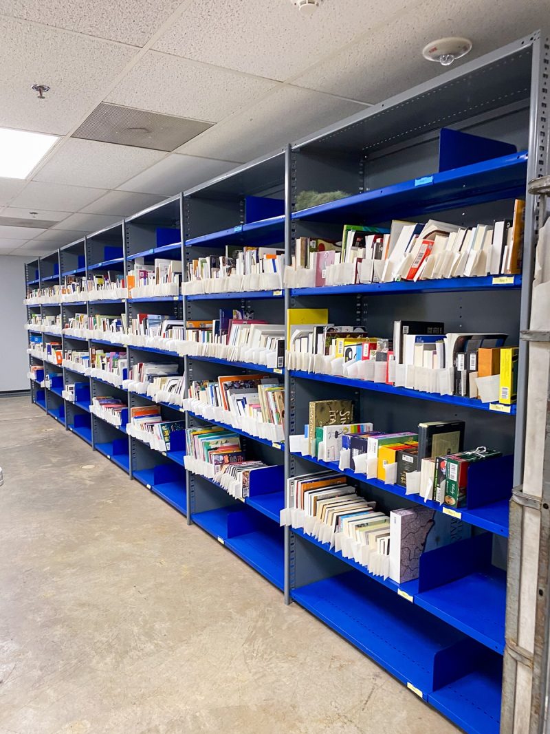 rows of books on blue shelving