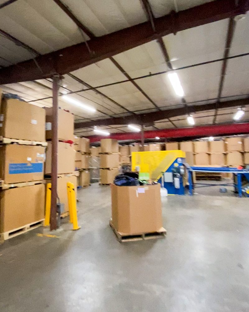 gaylords stacked high at the goodwill e-commerce home office