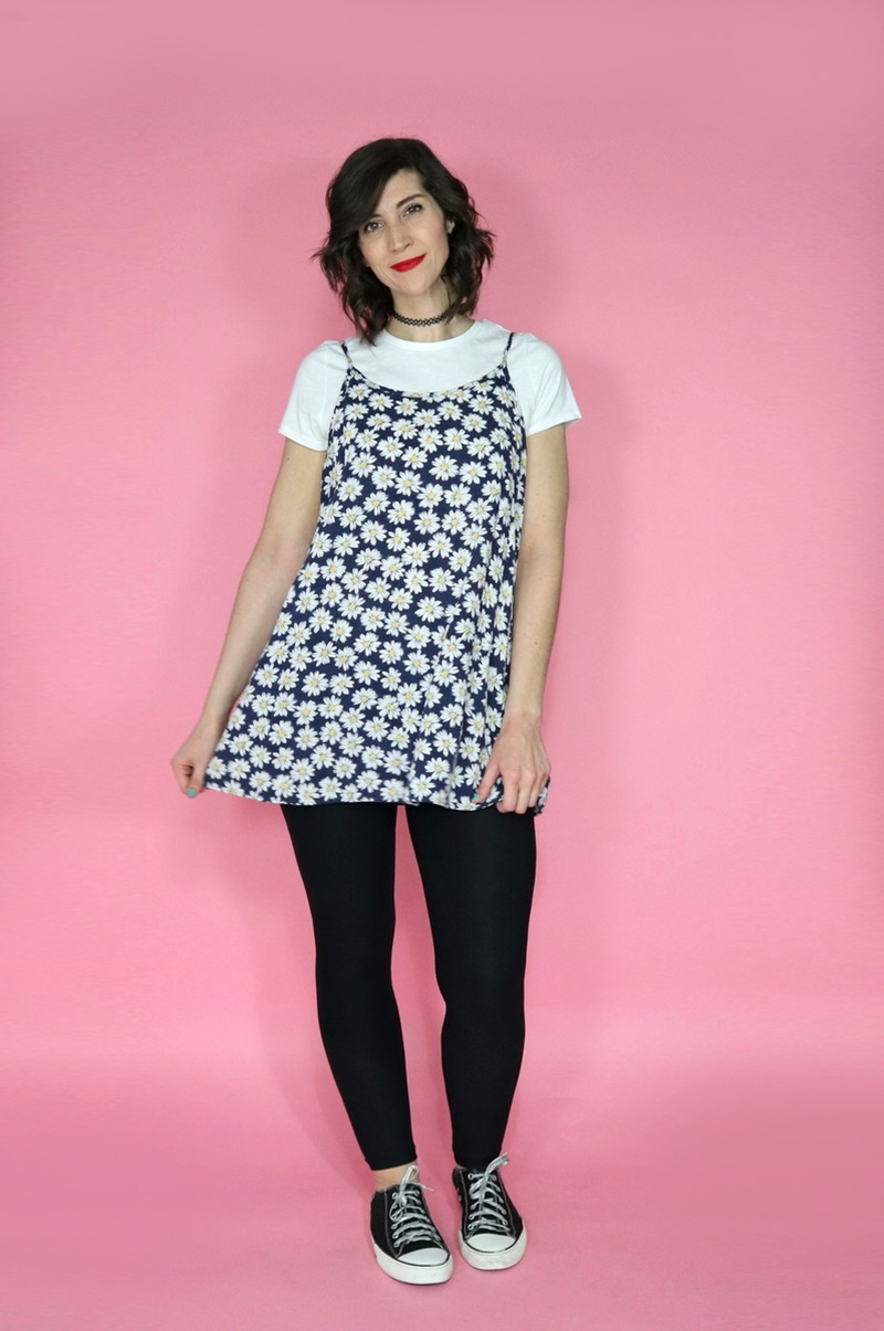 10 Essential Outfits You Should Always Have In Your Closet | theoutfitrepeater.com white female wearing red lipstick, blue daisy dress, and black leggings