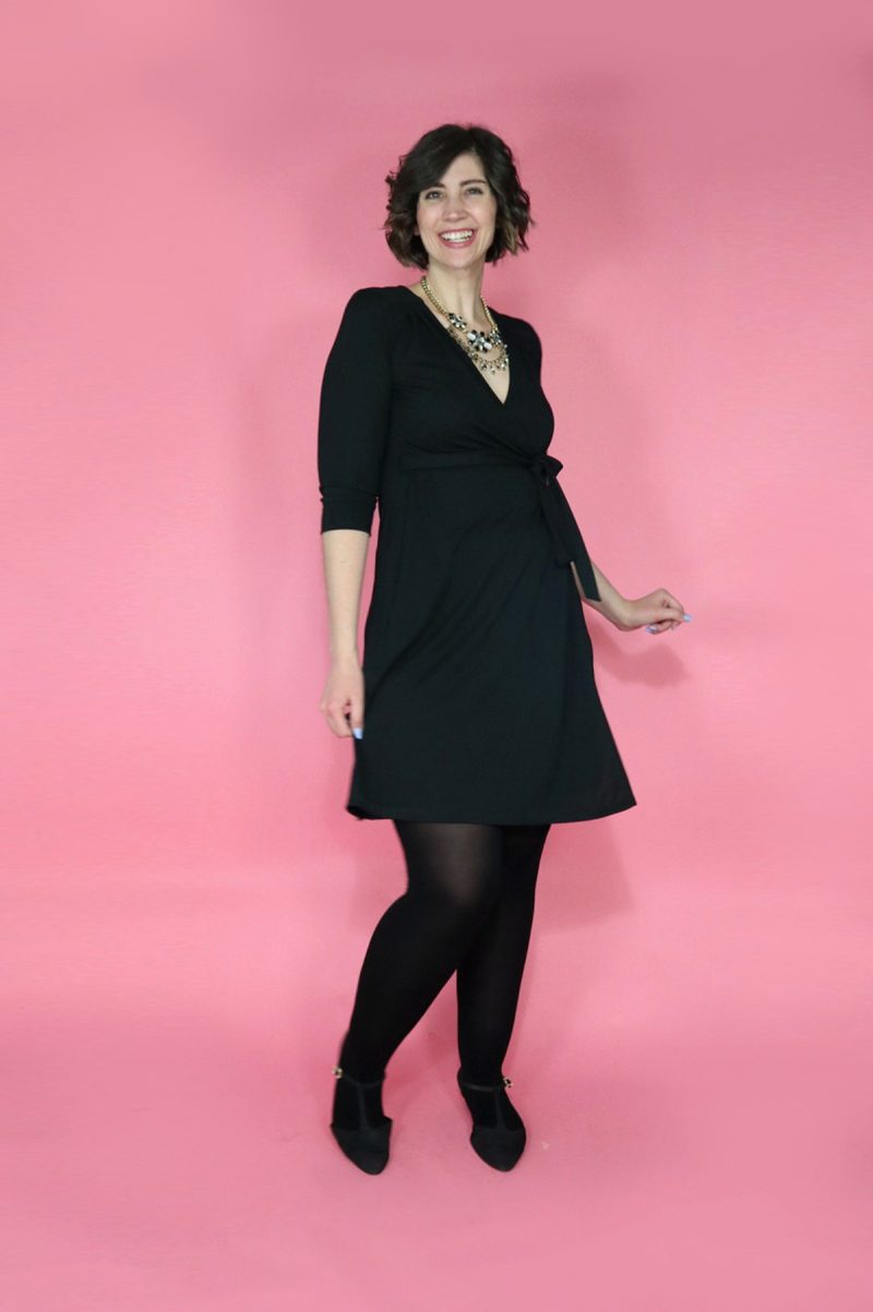 10 Essential Outfits You Should Always Have In Your Closet | theoutfitrepeater.com White female with short brown hair wearing a black wrap dress and black tights