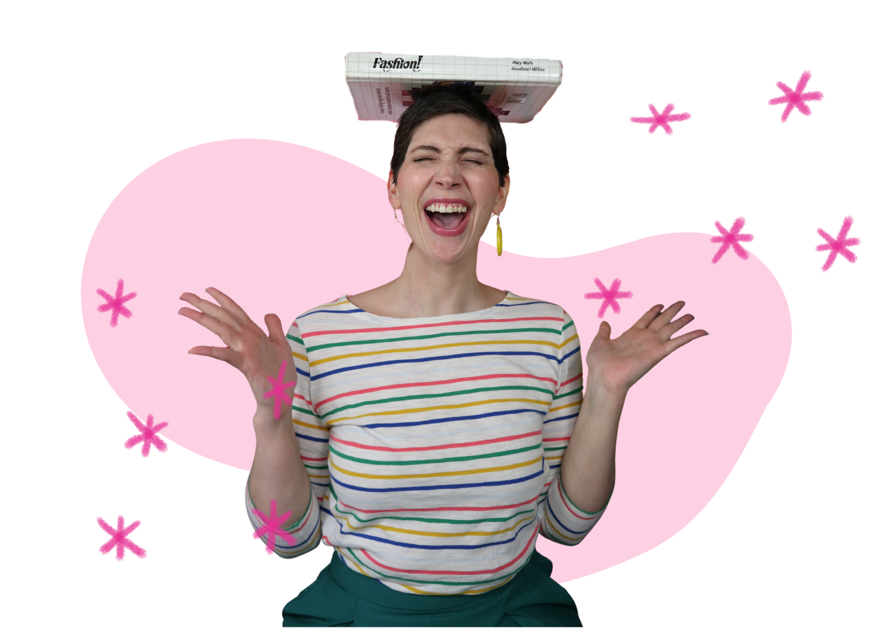 a while female with a short pixie cut is smiling in a colorful outfit while balancing a fashion book on her head